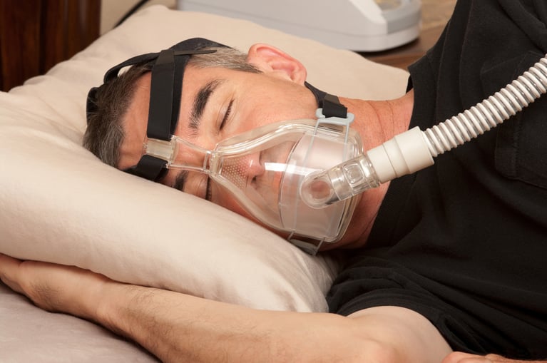 man in sleep apnea mask