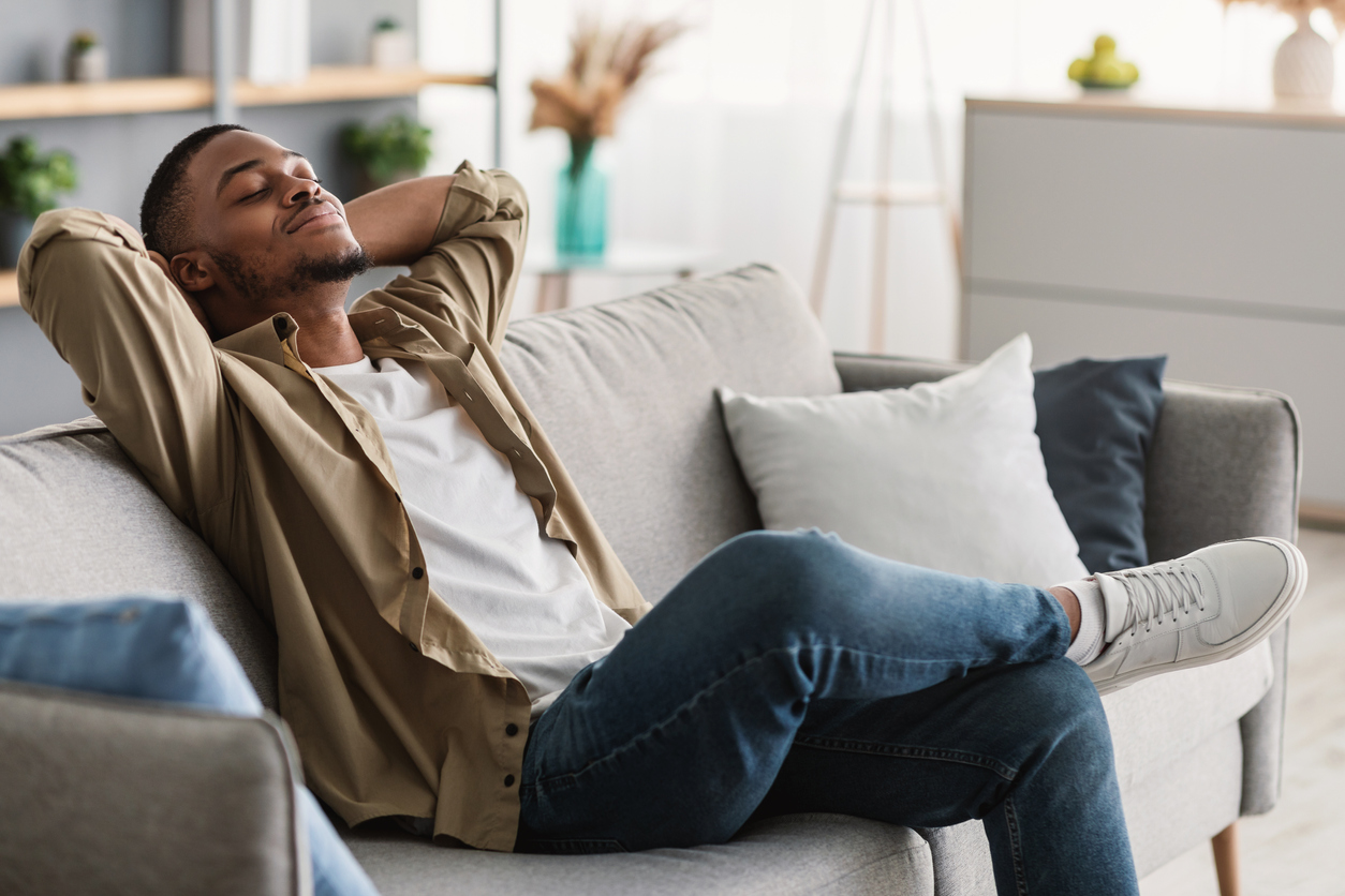 A man relaxing on the couch.