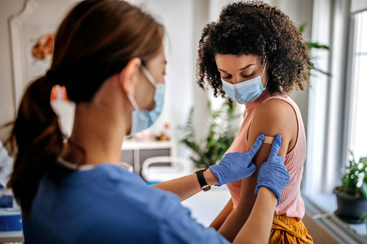  A woman getting vaccinated.