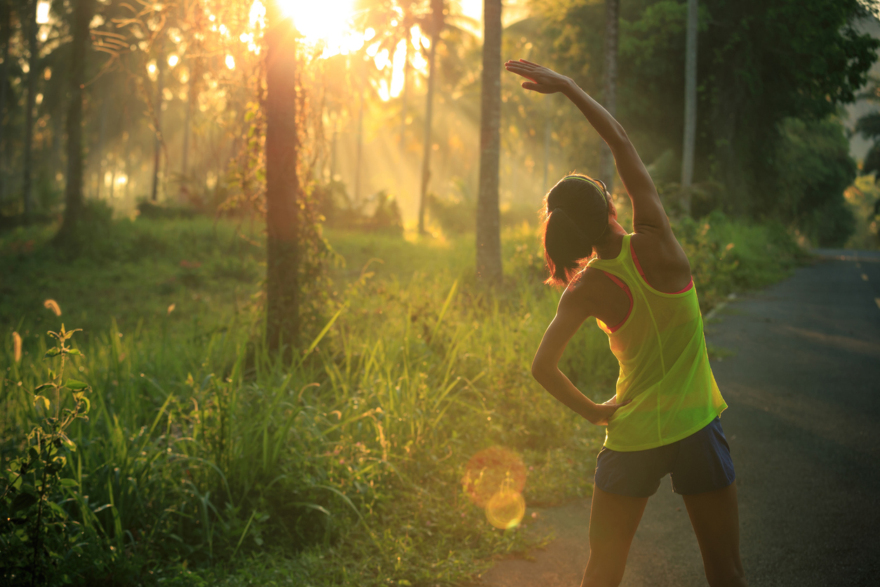 Women stretching in the sunlight.